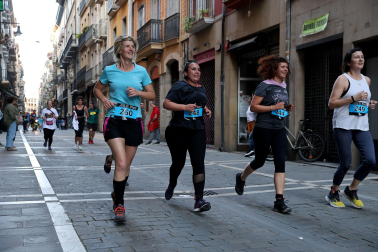Fotos de la Tres Burgos Tres Millas celebrada este viernes en Pamplona.