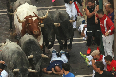 Fotos del sexto encierro de San Fermín 2025 en Pamplona. |