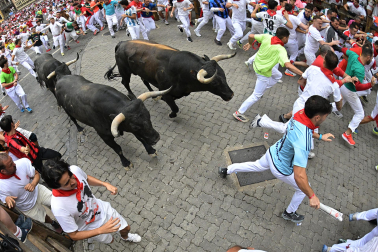 Fotos del séptimo encierro de San Fermín 2026 con toros de Miura.
