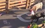 A northamerican marine runs over the Running of the Bulls in Tudela