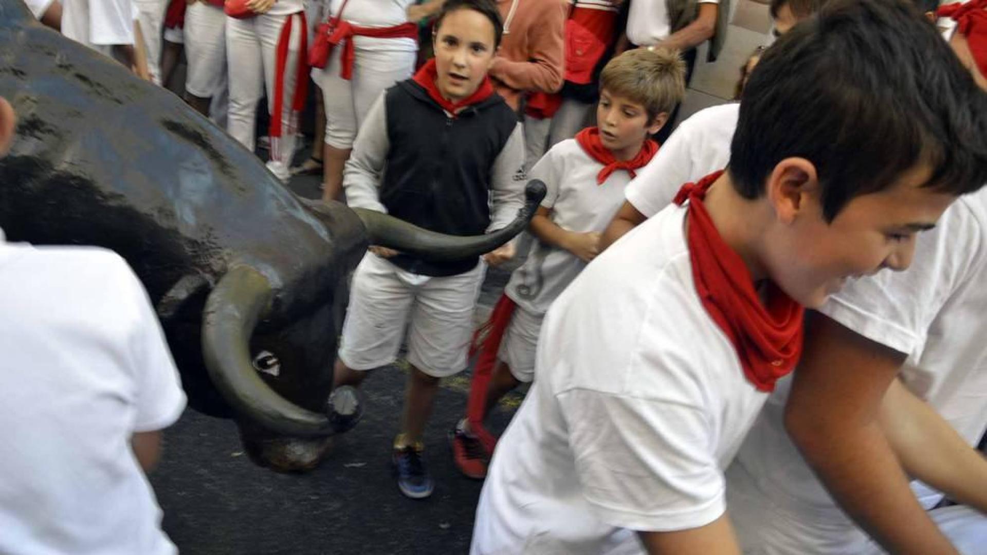 Imágenes del encierro txiki del día 13 de San Fermín
