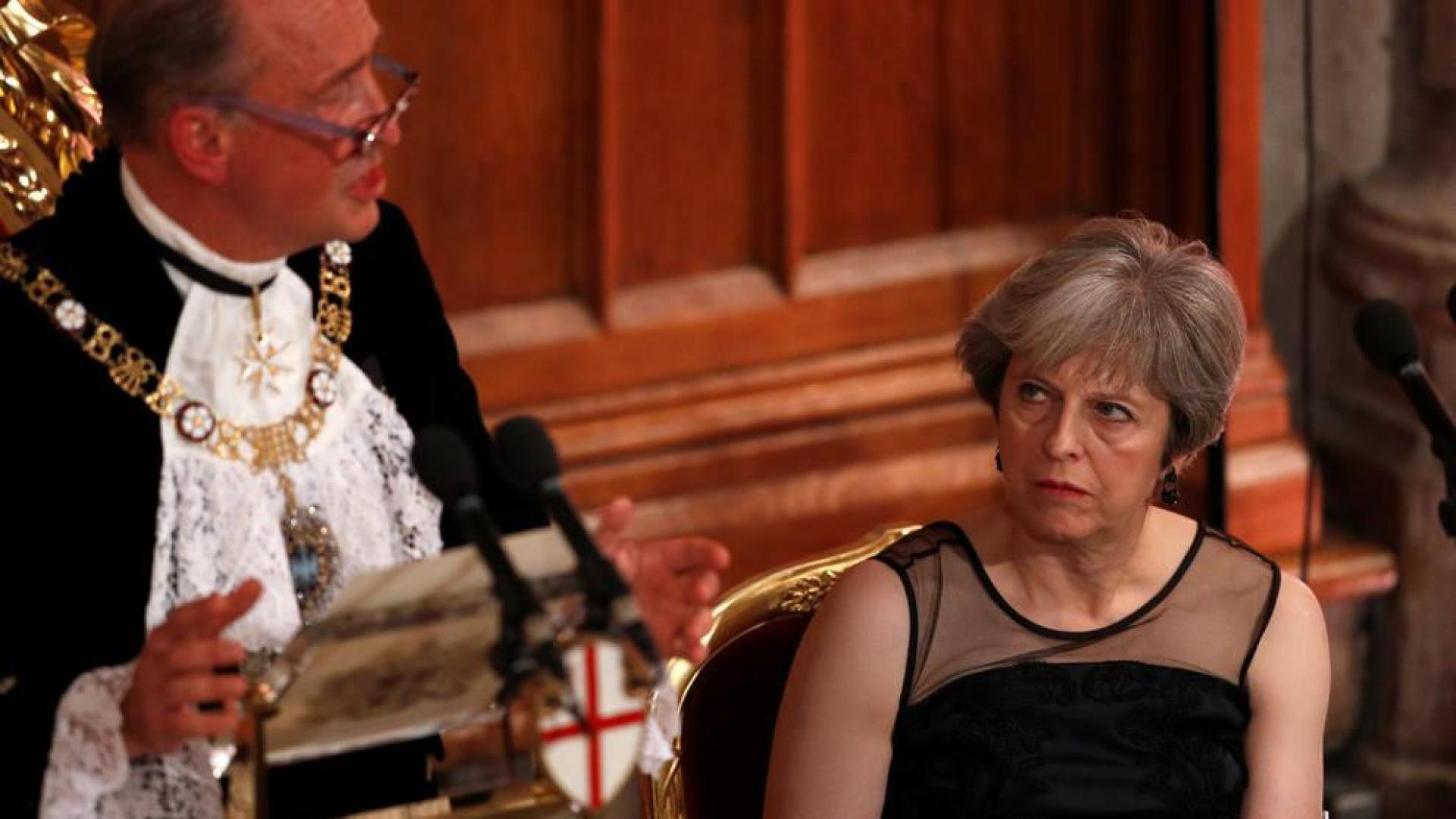 May acusa a Putin de "entrometerse y apoyar ataques cibernéticos"