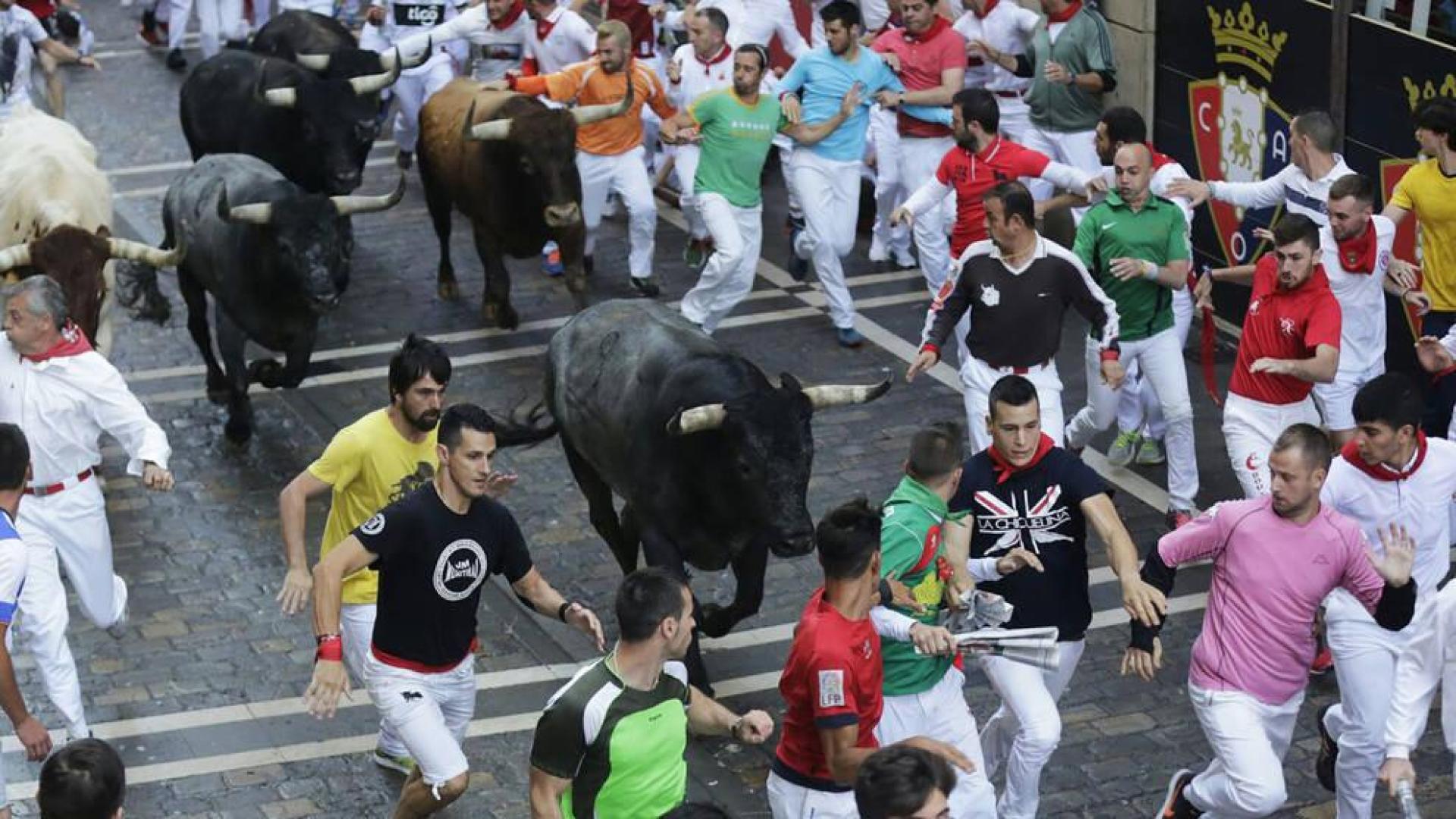 Imágenes del octavo encierro de los Sanfermines de 2018, con toros de la ganadería Miura.