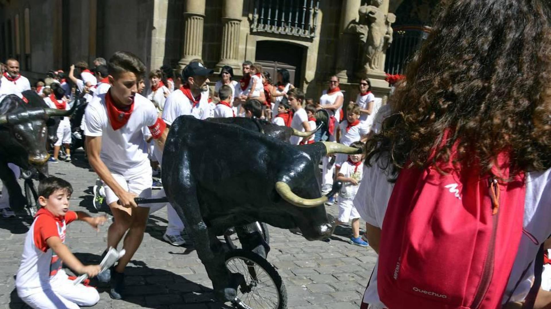 Imágenes del encierro txiki del día 13 de San Fermín