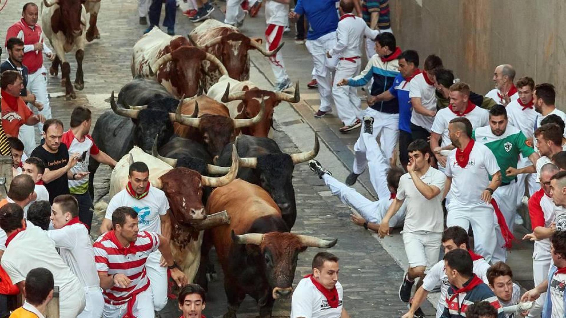 Imágenes del octavo encierro de los Sanfermines de 2018, con toros de la ganadería Miura.