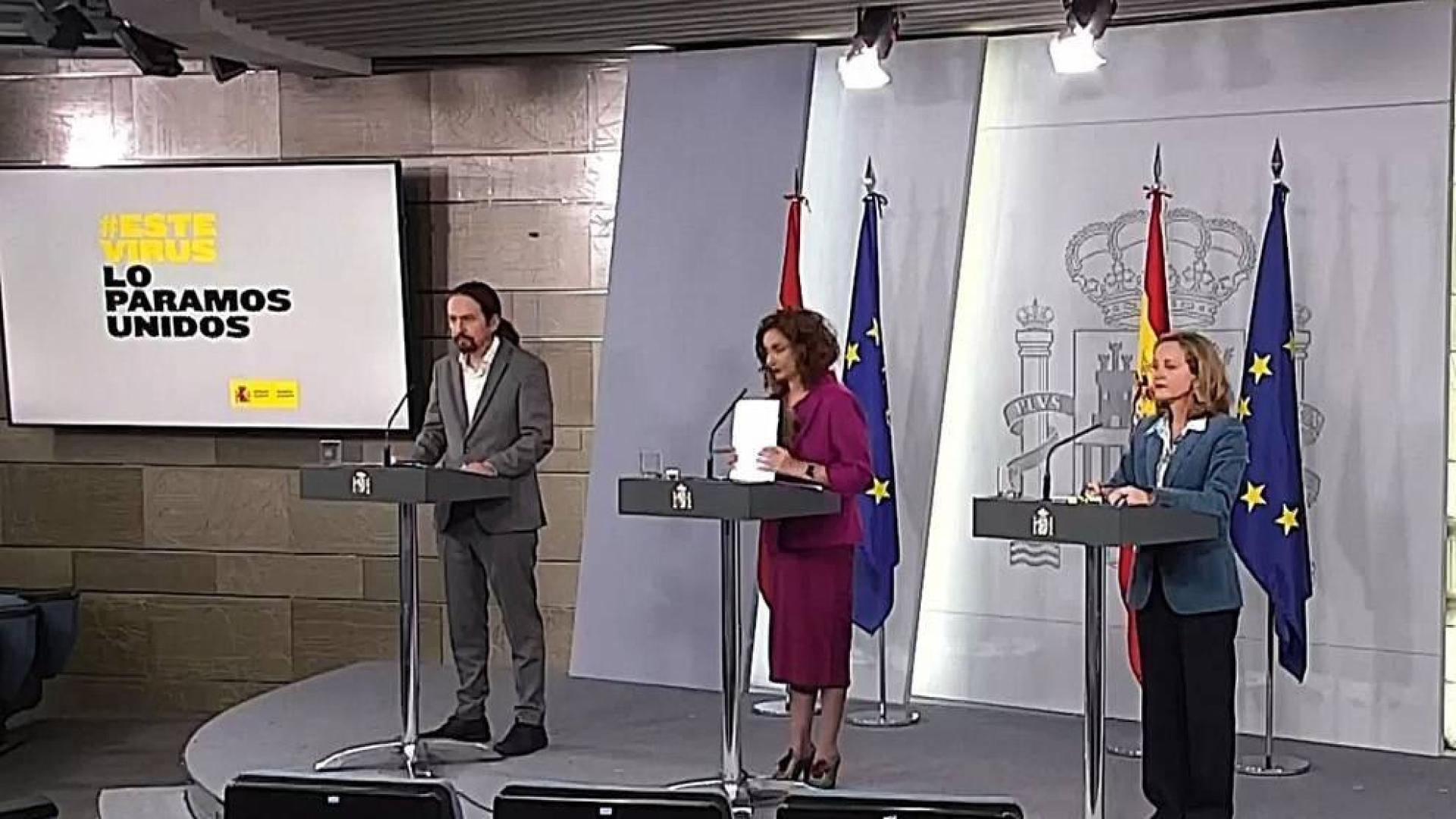Nadia Calviño, María Jesús Montero y Pablo Iglesias, durante la rueda de prensa.