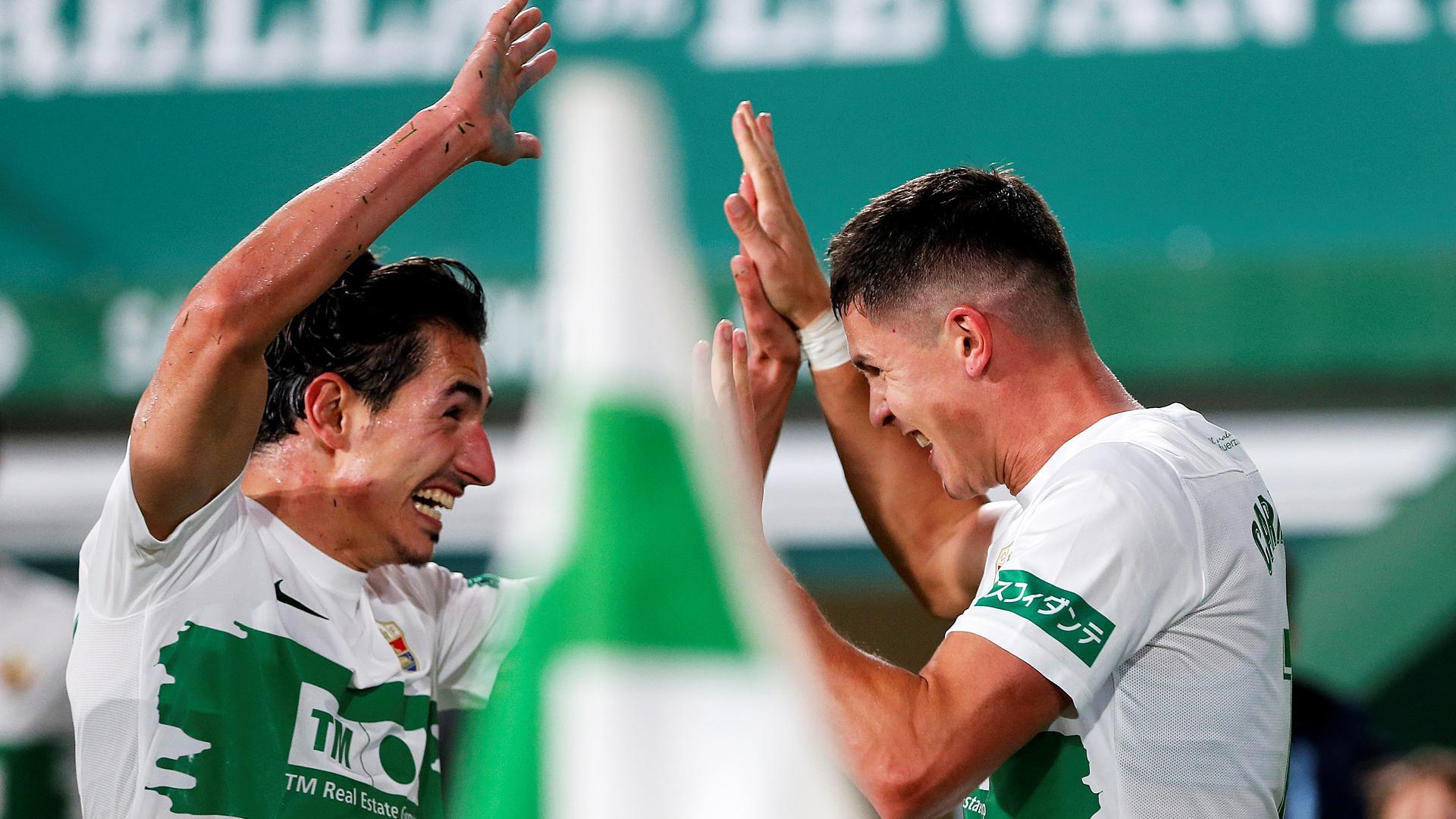 Pere Milla y Guido Carrillo celebran el tanto dle empate, obra del segundo