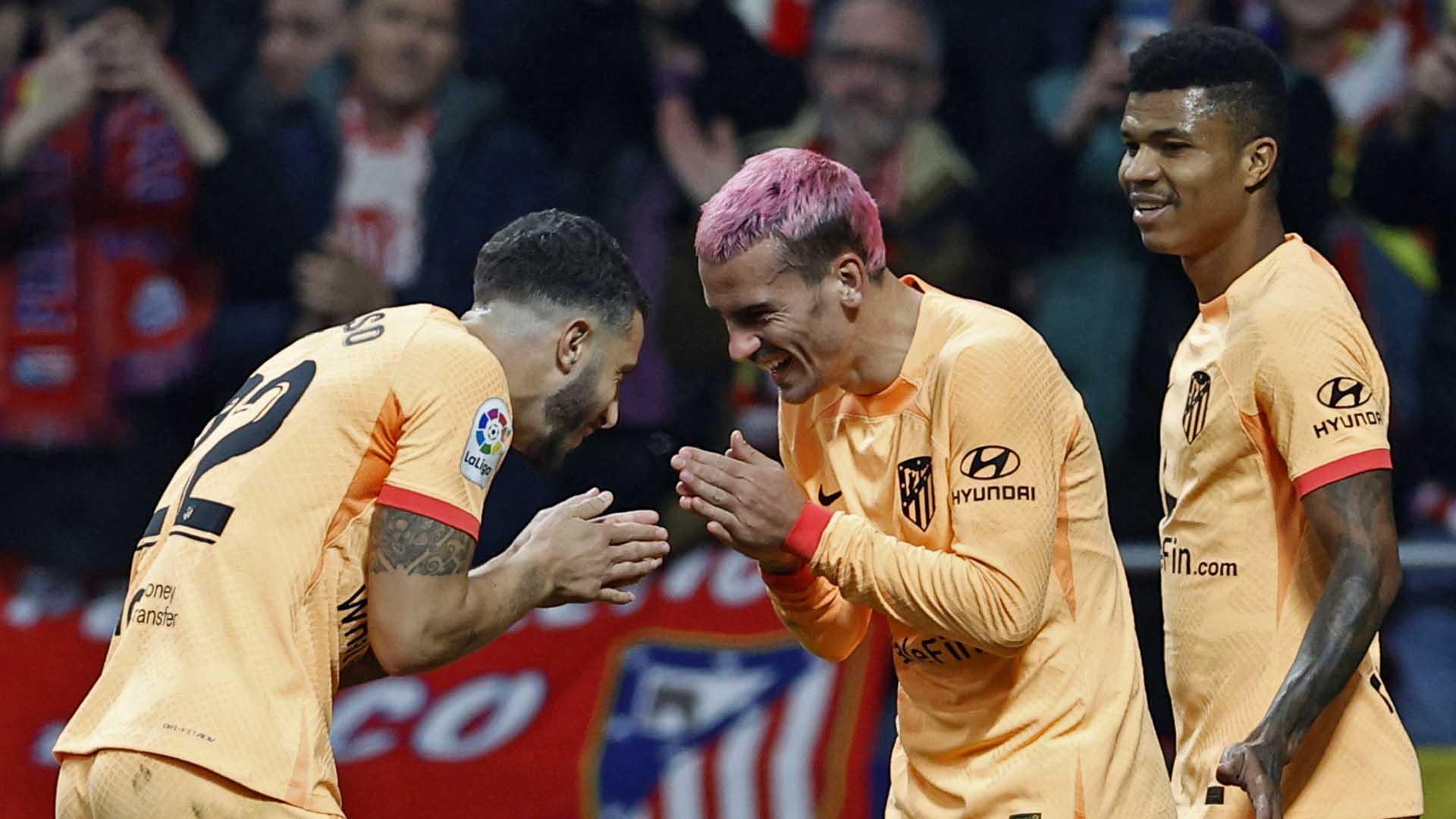 Griezmann celebrando su gol con Mario Hermoso