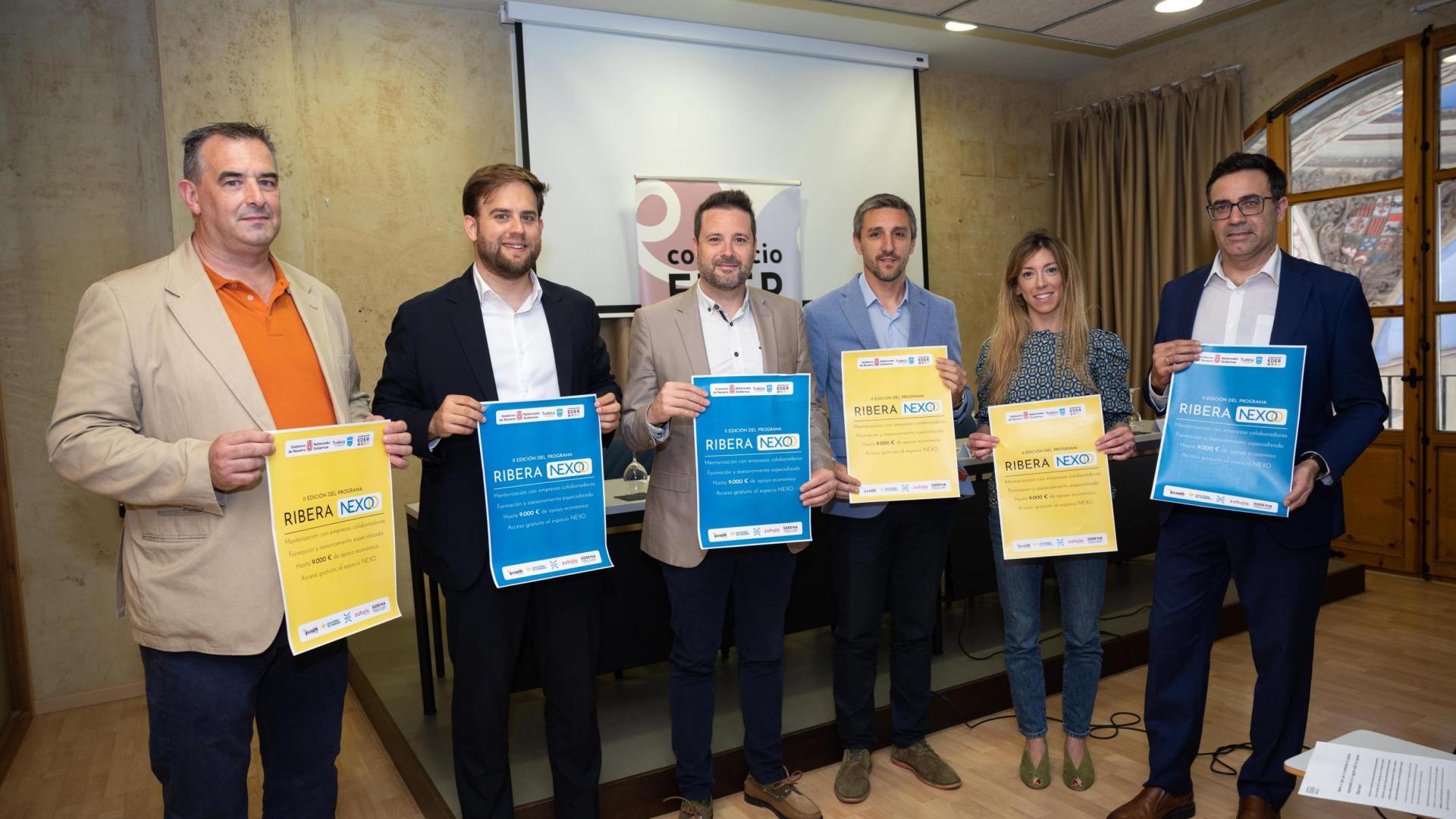 A: BLANCA ALDANONDO
F: 14/06/2023
P: DE IZDA. A DCHA.; RAFAEL LOSCOS SANZ (GRUPO AXIUM), GONZALO SOTO ESCUDERO (CAJA RURAL), ALEJANDRO TOQUERO GIL (PRESIDENTE CONSORCIO EDER), SERGIO VILLAVA GOMEZ (GERENTE CONSORCIO EDER), NATALIA OLIVER GIMENO (GRUPO ENHOL) Y EDUARDO REDRADO LITAGO (ZABALA INNOVATION)
L: TUDELA
T: CONSORCIO EDER; PRESENTACION DE LA II EDICION DEL PROGRAMA RIBERA NEXO