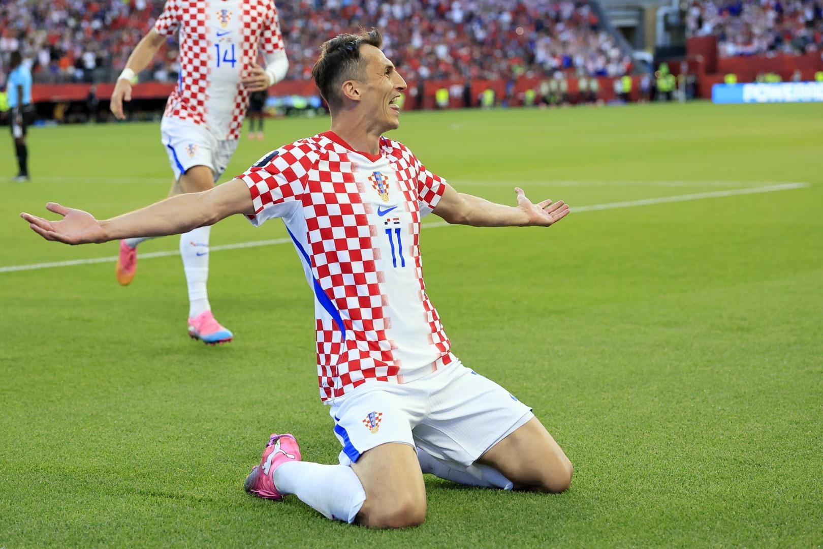 Fotos del debut goleador de Budimir en el Mundial.