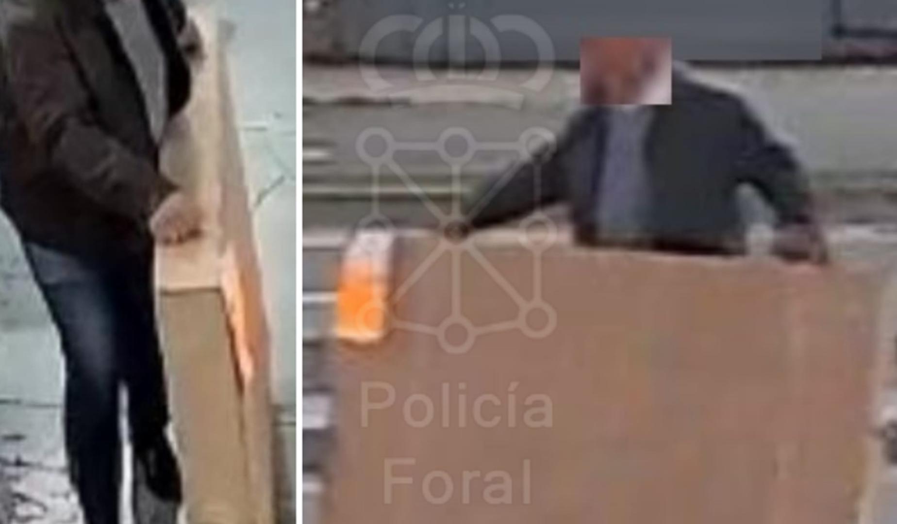 Uno de los arrestados, con la televisión en imágenes de las cámaras de seguridad