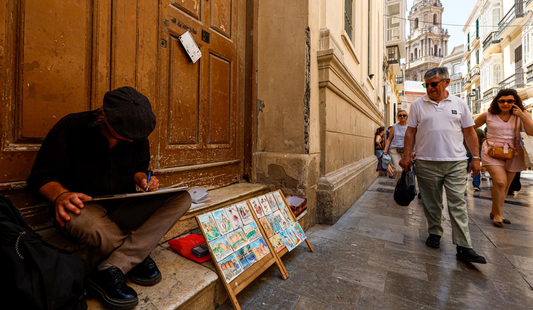 Un pintor callejero en el centro de Málag