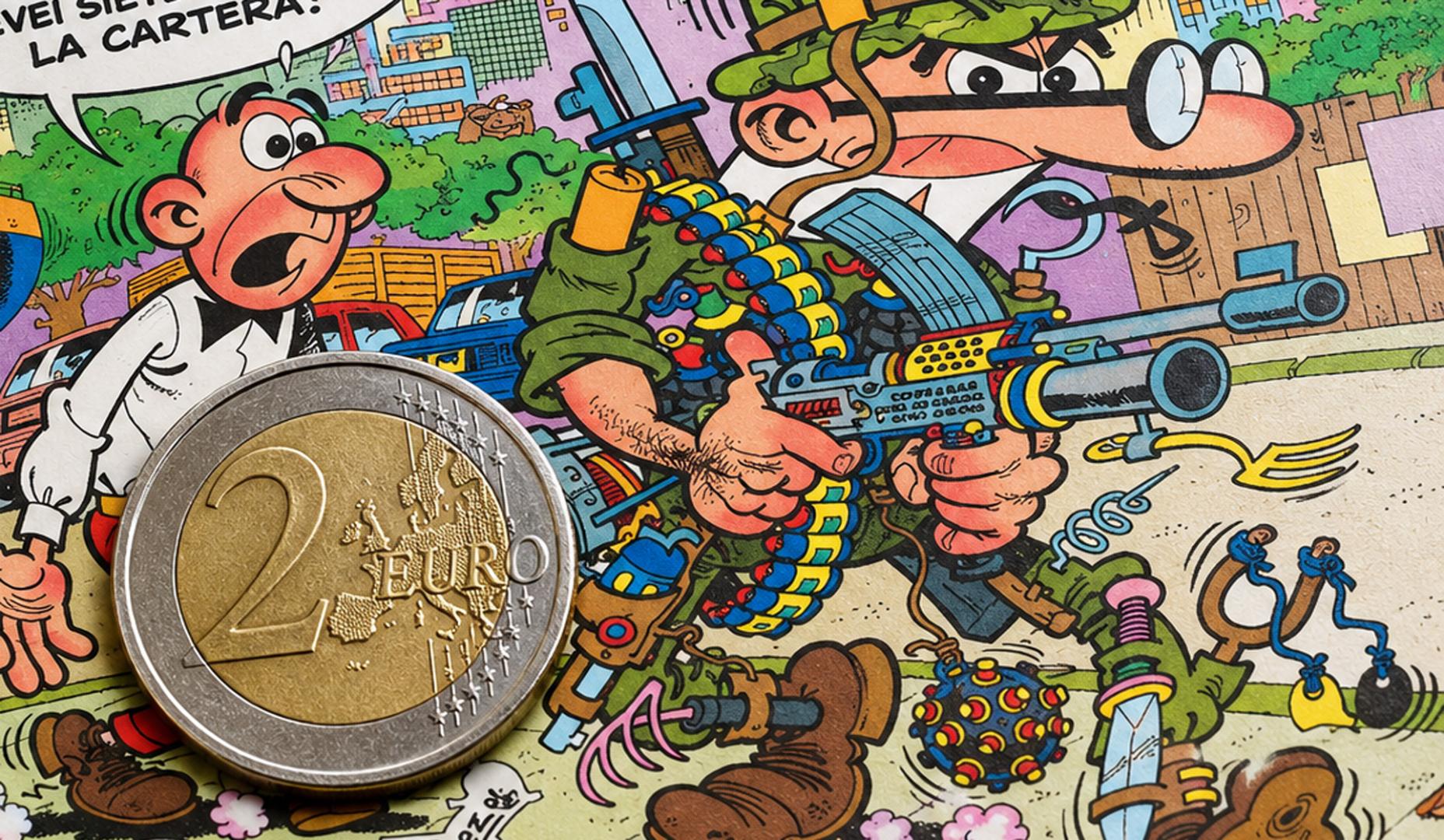 Moneda de 2 euros sobre un tebeo de Mortadelo y Filemón