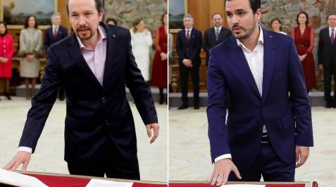 Iglesias y Garzón prometen su cargo con un pin del triángulo rojo invertido, que simboliza la lucha antifascista Iglesias y Garzón prometen su cargo con un pin del triángulo rojo invertido, que simboliza la lucha antifascista