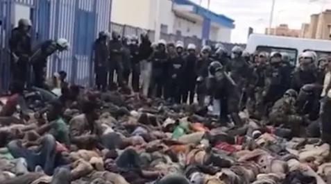melilla asalto valla Decenas de migrantes malheridos en el suelo, después de la batalla campal