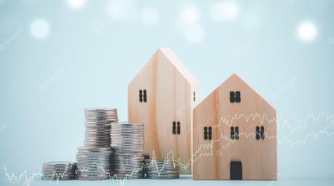 Monedas y casas de madera El precio de las hipotecas.