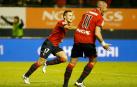 Camuñas celebra su gol contra el Madrid en 2011 junto a Aranda