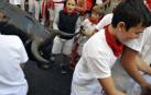 Imágenes del encierro txiki del día 13 de San Fermín