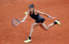 Muguruza apea a Kuznetsova y avanza a segunda ronda, donde se mide con Ferro