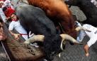 Imágenes del octavo encierro de los Sanfermines de 2018, con toros de la ganadería Miura.