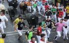 Imágenes del octavo encierro de los Sanfermines de 2018, con toros de la ganadería Miura.