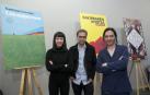 Desde la izquierda, Júlia Sardà, Harkaitz Cano y Santiago Lorenzo, ayer, con las portadas de sus libros, en el Museo de Navarra.