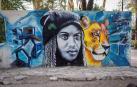Los artistas decoran los muros de la capital senegalesa en la décima edición del festival de arte urbano