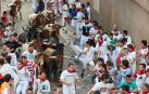 Imágenes del octavo encierro de los Sanfermines de 2018, con toros de la ganadería Miura.