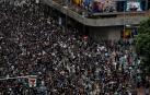 Miles de personas marchan en Hong Kong al grito de "revolución"