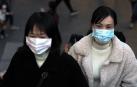 Dos mujeres se protegen con máscaras, en Taipei (Taiwan).