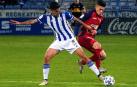 Quiles y Roncaglia pelean por el balón en el partido Recreativo-Osasuna de Copa del Rey.