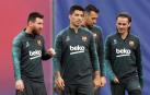 El tridente del Barcelona, Messi, Suárez y Griezman, en un entrenamiento previo al partido de Champions