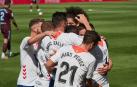 Los jugadores de Osasuna celebran el gol de Enric Gallego.