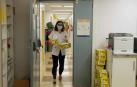 Fotos que muestran cómo se trabaja en el laboratorio del pabellón L del Complejo Hospitalario de Navarra donde se analizan las PCR