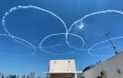Japan's Air Self Defense Force (JASDF) aerobatics team, the Blue Impulse, skywrite Olympic rings in a practice run ahead of the official opening of the Tokyo 2020 Olympic Games in Japan, July 21, 2021, in this still image obtained from social media video.  TWITTER/@KONO_MI0624/via REUTERS THIS IMAGE HAS BEEN SUPPLIED BY A THIRD PARTY. MANDATORY CREDIT. NO RESALES. NO ARCHIVES.