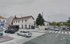 Calle del Muelle. A la izquierda, la estación de tren