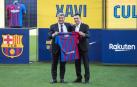 Xavi Hernandez y Joan Laporta durante la presentación del técnico culé