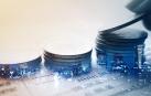Double exposure of city and rows of coins for finance and banking concept