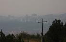 Fotos de la cortina de humo que cubre Pamplona este viernes.