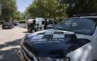 Coches de la Policía Local en el recinto ferial donde se inició la pelea en Alcalá de Henares