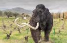 Recreación de un mamut en primer plano y dinosaurios al fondo, en el parque de dinosaurios de Atenas (Grecia).