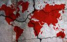 Silueta del mundo con los continentes teñidos de rojo.