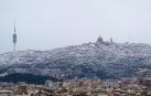 Aspecto de la montaña del Tibidabo de Barcelona tras la nevada caída la pasada madrugada