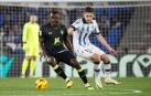 El defensa senegalés del Almería, Dion Lopy (i), se lleva el balón ante el centrocampista ruso de la Real Sociedad, Arsen Zakharyan