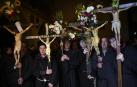 Catholics penitents of the Virgin carry crucifixes decorate with flowers as they take part in a pilgrimage from Tafalla and other villages to the small town of Ujue, northern Spain, Sunday, April 28, 2024. Devotees walk around 25 km (16 miles) from their villages to Ujue in honour of the Virgin. (AP Photo/Alvaro Barrientos)