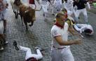 Fotos del tercer encierro de San Fermín 2025 en Pamplona.