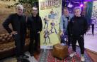 Los cuatro integrantes de Hombres G posan junto al cartel de su próxima gira, 'Los mejores años de nuestra vida'